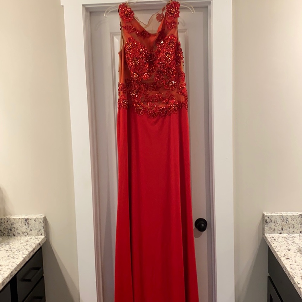 Red floor length evening gown.